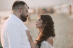 Bride and groom photographed in soft evening light rather than midday sun